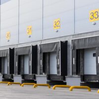 Entrance ramps of a large distribution warehouse with gates for loading goods