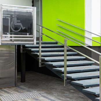 Entry to block of flats building with elevator for physically handicapped people