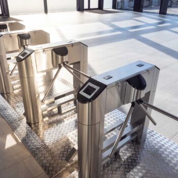 Electronic turnstile. Access system to the building. Pass through the passes. Security systems for rooms. Several turnstiles are installed nearby. Check Point. Automatic checkpoint. Building security.