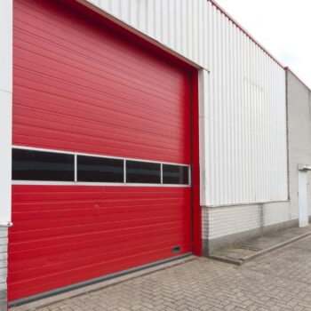 industrial warehouse with red roller door